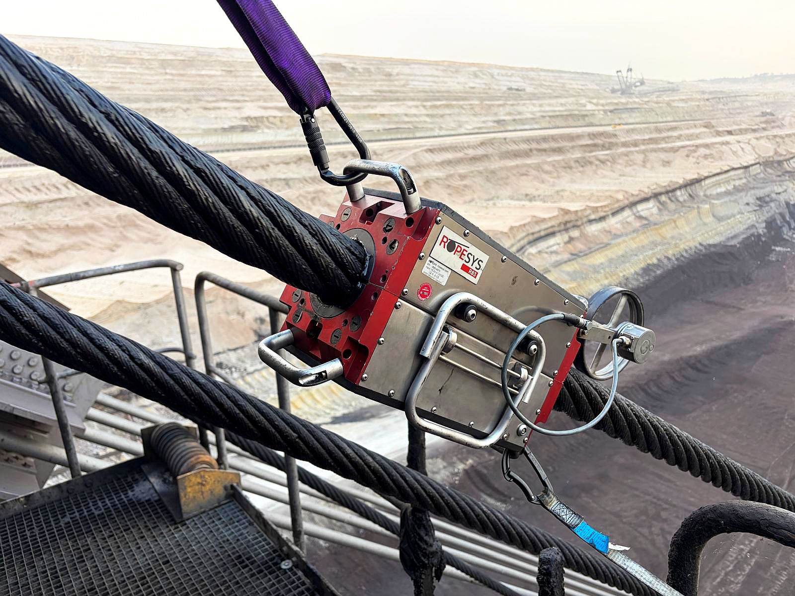 ROPESYS R83 rope testing device inspecting a 75 mm hoist rope at the Hambach open-cast mine.